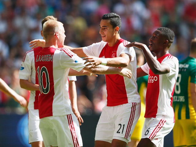 Anwar El Ghazi #21 of Ajax celebrates scoring his teams second goal of the game with team mates during the Dutch Eredivisie match between Ajax Amsterdam and ADO Den Hagg on August 30, 2015