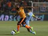 Apoel's Vander and FC Astana's Tanat Nuserbayev in action during UEFA Champions League play off between APOEL Nicosia and FC Astana at GSP Stadium on August 26, 2015 in Nicosia, Cyprus.
