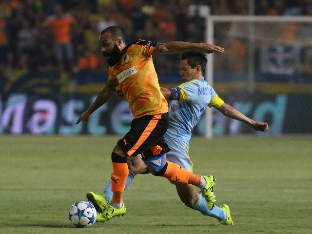 Apoel's Vander and FC Astana's Tanat Nuserbayev in action during UEFA Champions League play off between APOEL Nicosia and FC Astana at GSP Stadium on August 26, 2015 in Nicosia, Cyprus.