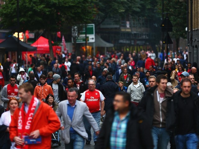 Arsenal and Liverpool fans arrive at the Emirates ahead of kickoff on August 24, 2015
