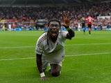Swansea striker Bafetimbi Gomis celebrates after scoring the second swansea goal during the Barclays Premier League match between Swansea City and Manchester United on August 30, 2015