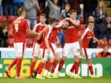 Marley Watkins of Barnsley is congratulated by team mates after scoring his team's second goal during the Capital One Cup second round match between Barnsley and Everton at Oakwell Stadium on August 26, 2015 in Barnsley, England.