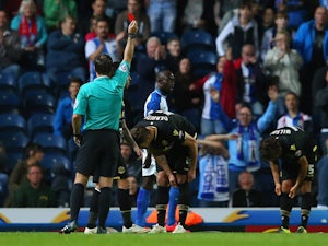 Dorian Dervite of Bolton Wanderers is sent off by referee Paul Tierney during the Sky Bet Championship match between Blackburn Rovers and Bolton Wanderers at Ewood park on August 28, 2015