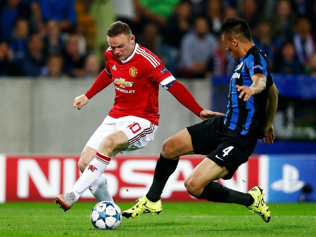 Wayne Rooney of Manchester United takes on Oscar Duarte of Club Brugge during the UEFA Champions League qualifying round play off 2nd leg match between Club Brugge and Manchester United held at Jan Breydel Stadium on August 26, 2015 in Brugge, Belgium.