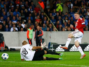Rooney hat-trick sees United through