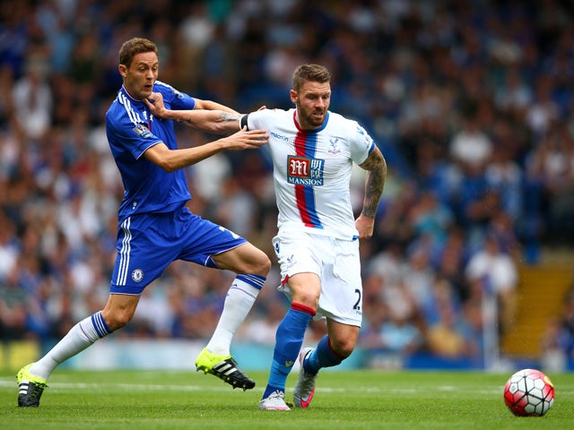Connor Wickham of Crystal Palace and Nemanja Matic of Chelsea compete for the ball during the Barclays Premier League match between Chelsea and Crystal Palace at Stamford Bridge on August 29, 2015