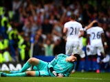 Thibaut Courtois of Chelsea reacts after conceding Crystal Palace's first goal during the Barclays Premier League match between Chelsea and Crystal Palace at Stamford Bridge on August 29, 2015