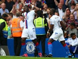 Bakary Sako of Crystal Palace celebrates scoring his team's first goal with his team mate Yannick Bolasie during the Barclays Premier League match between Chelsea and Crystal Palace at Stamford Bridge on August 29, 2015