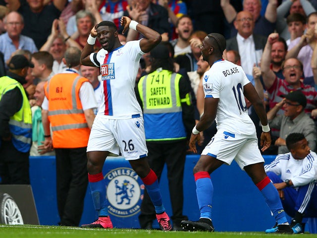 Bakary Sako of Crystal Palace celebrates scoring his team's first goal with his team mate Yannick Bolasie during the Barclays Premier League match between Chelsea and Crystal Palace at Stamford Bridge on August 29, 2015