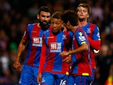 Dwight Gayle of Crystal Palace (c) is congratulated by his team mates after scoring his side's first goal from the penatly spot during the Capital One Cup second round match between Crystal Palace and Shrewsbury Town at Selhurst Park on August 25, 2015