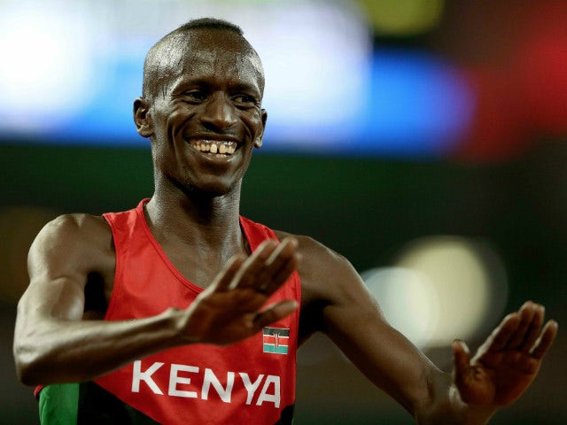 BEIJING, CHINA - AUGUST 24: Ezekiel Kemboi of Kenya celebrates after winning gold in the Men's 3000 metres steeplechase final during day three of the 15th IAAF World Athletics Championships Beijing 2015 at Beijing National Stadium on August 24, 2015 in Be