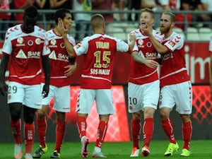 Reims leapfrog PSG with Lorient rout