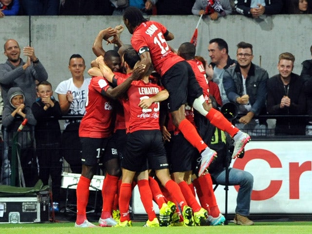 Guingamp's players celebrate after scoring a goal during the French L1 football match between Guingamp (EAG) and Marseille (OM) on August 28, 2015