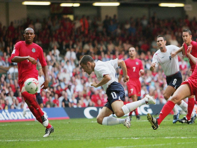 Joe Cole of England goes close to scoring a diving header during the 2006 World Cup Qualifying match between Wales and England at the Millennium Stadium on September 3, 2005