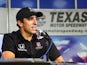 Andretti Autosport driver Justin Wilson answers questions during an interview after the Speeding to Read championship assembly at Texas Motor Speedway on May 19, 2015