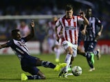 Uruguay's River Plate Leandro Rodriguez vies for the ball with Ecuador's Emelec Gabriel Achilier during their Copa Sudamericana football match at George Capwell stadium in Guayaquil, Ecuador, on September 18, 2014