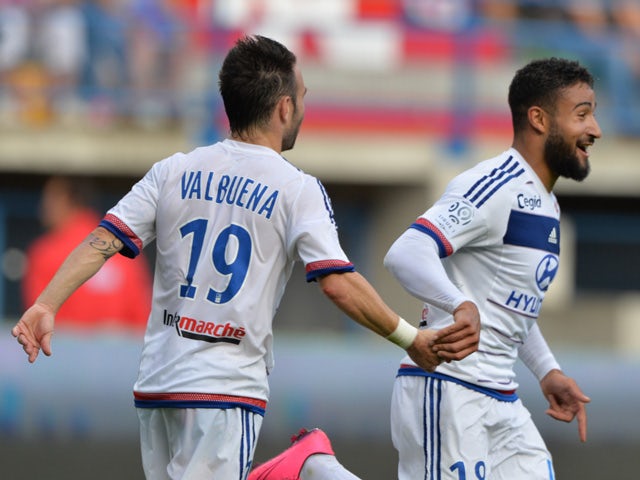 Lyon's French midfielder Nabil Fekir is congratulated by his teammate Mathieu Valbuena during the French L1 football match between Caen (SM Caen) and Olympique Lyonnais, on August 29, 2015