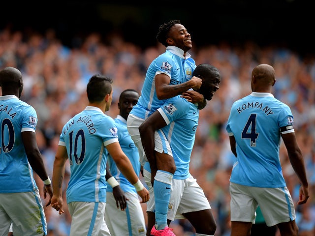 Raheem Sterling of Manchester City celebrates scoring his team's first goal with his team mates during the Barclays Premier League match between Manchester City and Watford at Etihad Stadium on August 29, 2015