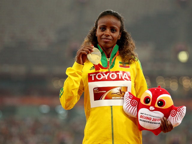Gold medalist Mare Dibaba of Ethiopia poses on the podium during the medal ceremony for the Women's Marathon final during day nine of the 15th IAAF World Athletics Championships Beijing 2015 at Beijing National Stadium on August 30, 2015