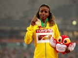 Gold medalist Mare Dibaba of Ethiopia poses on the podium during the medal ceremony for the Women's Marathon final during day nine of the 15th IAAF World Athletics Championships Beijing 2015 at Beijing National Stadium on August 30, 2015