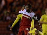 Mustapha Carayol of Middlesbrough gets past Jazz Richards of Huddersfield during the Sky Bet Championship match between Middlesbrough and Huddersfield Town at Riverside Stadium on October 01, 2013