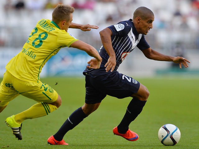 Bordeaux's French-born Tunisian midfielder Wahbi Khazri (R) vies with Nantes' French midfielder Valentin Rongier (L) during the French Ligue 1 football match between Bordeaux (FCGB) and Nantes on August 30, 2015