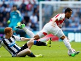 Francis Coquelin of Arsenal is tackled by Jack Colback of Newcastle United during the Barclays Premier League match between Newcastle United and Arsenal at St James' Park on August 29, 2015