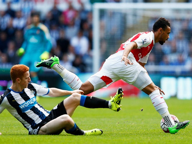 Francis Coquelin of Arsenal is tackled by Jack Colback of Newcastle United during the Barclays Premier League match between Newcastle United and Arsenal at St James' Park on August 29, 2015