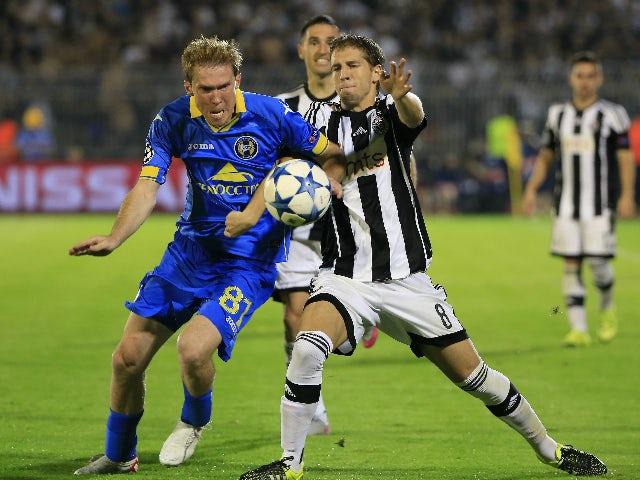 Aleksandr Hleb (L) of BATE in action against Darko Brasanac (R) of Partizan Belgrade during the UEFA Champions League Qualifying Round Play Off Second Leg match between Partizan Belgrade and BATE at Partizan stadium on August 26, 2015 in Belgrade, Serbia