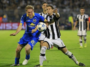 Aleksandr Hleb (L) of BATE in action against Darko Brasanac (R) of Partizan Belgrade during the UEFA Champions League Qualifying Round Play Off Second Leg match between Partizan Belgrade and BATE at Partizan stadium on August 26, 2015 in Belgrade, Serbia