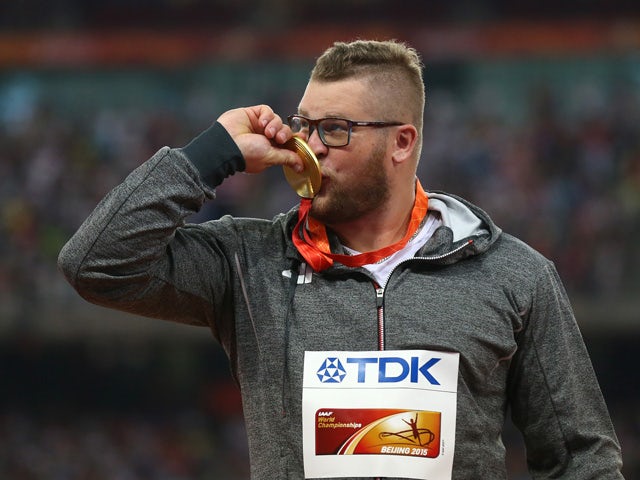 Gold medalist Pawel Fajdek of Poland poses on the podium during the medal ceremony for the Men's Hammer final during day two of the 15th IAAF World Athletics Championships Beijing 2015 at Beijing National Stadium on August 23, 2015