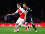 Liverpool's Philippe Coutinho chases Hector Bellerin of Arsenal on August 24, 2015