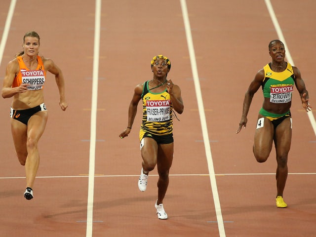 Shelly-Ann Fraser-Pryce of Jamaica beats Dafne Schippers of the Netherlands (L) and Veronica Campbell-Brown of Jamaica to win gold in the Women's 100 metres final during day three of the 15th IAAF World Athletics Championships Beijing 2015 at Beijing Nati