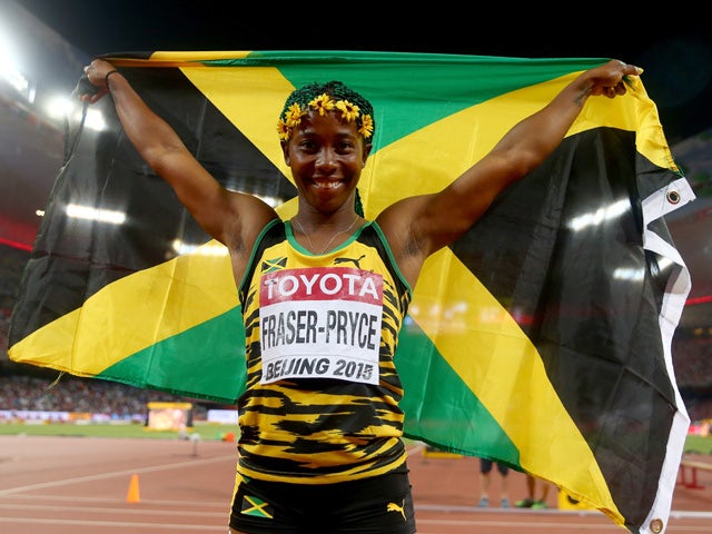Shelly-Ann Fraser-Pryce of Jamaica celebrates after winning gold in the Women's 100 metres final during day three of the 15th IAAF World Athletics Championships Beijing 2015 at Beijing National Stadium on August 24, 2015