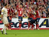 Lille's French midfielder Sofiane Boufal (C) is congratuled by his teammate after scoring a goal during the French L1 football match Lille vs Ajaccio on August 29, 2015