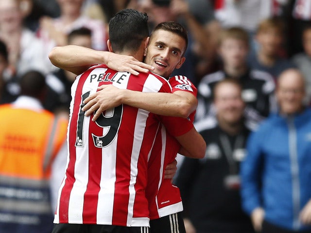 Southampton's Serbian midfielder Dusan Tadic celebrates with Southampton's Italian striker Graziano Pelle (L) after scoring their third goal during the English Premier League football match between Southampton and Norwich City at St Mary's Stadium in Sout