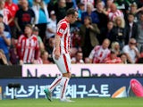 Charlie Adam of Stoke City walks off the pitch after being shown a red card during the Barclays Premier League match between Stoke City and West Bromwich Albion at Britannia Stadium on August 29, 2015 