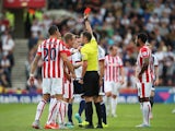 Ibrahim Afellay of Stoke City is shown a red card by referee Michael Oliver during the Barclays Premier League match between Stoke City and West Bromwich Albion at Britannia Stadium on August 29, 2015