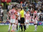 Ibrahim Afellay of Stoke City is shown a red card by referee Michael Oliver during the Barclays Premier League match between Stoke City and West Bromwich Albion at Britannia Stadium on August 29, 2015