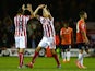 Marc Wilson and Philipp Wollscheid of Stoke City celebrate the goal scored by Jonathan Walters of Stoke City during the Capital One Cup second round match between Luton Town and Stoke City at Kenilworth Road on August 25, 2015