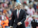 Mark Hughes manager of Stoke City leaves the pitch after the final whistle during the Barclays Premier League match between Stoke City and West Bromwich Albion at Britannia Stadium on August 29, 2015 