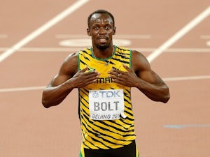 Bolt recovers from stumble to win 100m