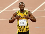'Big' Usain Bolt celebrates on his knees after winning gold in the men's 200m at the World Championships on August 27, 2015
