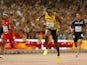 Usain Bolt of Jamaica crosses the finish line to win gold in the Men's 4x100 Metres Relay final ahead of Mike Rodgers of the United States during day eight of the 15th IAAF World Athletics Championships Beijing 2015 at Beijing National Stadium on August 2