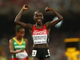  Vivian Jepkemoi Cheruiyot of Kenya crosses the finish line to win gold in the Women's 10000 metres final during day three of the 15th IAAF World Athletics Championships Beijing 2015 at Beijing National Stadium on August 24, 2015 