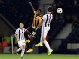 Claudio Yacob (R) of West Bromwich Albion and Enoch Andoh of Port Vale contest a header during the Capital One Cup Second Round match between West Bromwich Albion and Port Vale at The Hawthorns on August 25, 2015 
