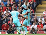 West Ham United's Argentinian midfielder Manuel Lanzani celebrates after scoring his team's first goal during the English Premier League football match between Liverpool and West Ham at the Anfield stadium in Liverpool, north-west England on August 29, 20