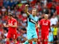 Mark Noble of West Ham United celebrates scoring his team's second goal from the penalty spot during the Barclays Premier League match between Liverpool and West Ham United at Anfield on August 29, 2015 