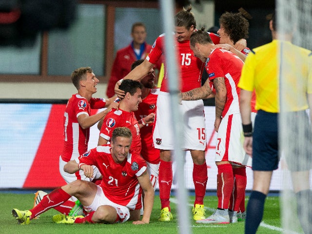 Austria's Zlatko Junuzovic (C) celebrates with team mates after scoring the first goal for Austria during the Euro 2016 qualifying Group G football match between Austria and Moldova in Vienna on September 5, 2015.