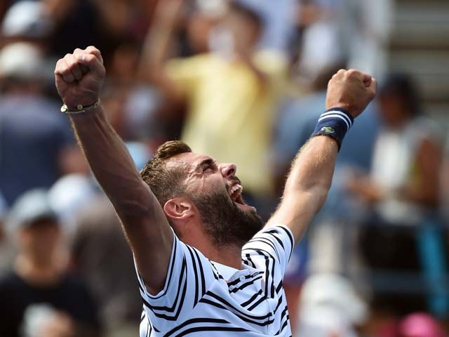 France's Benoit Paire celebrates defeating Japan's Kei Nishikori during their Mens Singles round 1 match of the US Open at USTA Billie Jean King National Tennis Center in New York on August 31, 2015